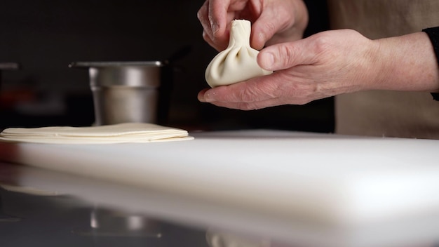 Chef preparing pierogi dough